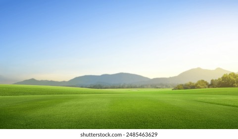 Golf teeing ground in golf course with sunrise background.