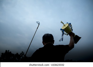 Golf Winner With A Trophy.