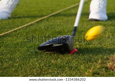 golfball being hit closeup