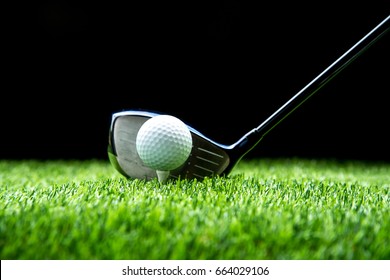 golf-club driver aim with golf ball, golfer prepare for swing, black color background.