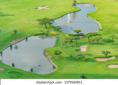 Golfcourse, Beautiful landscape of a golf court with palm trees and green grass.