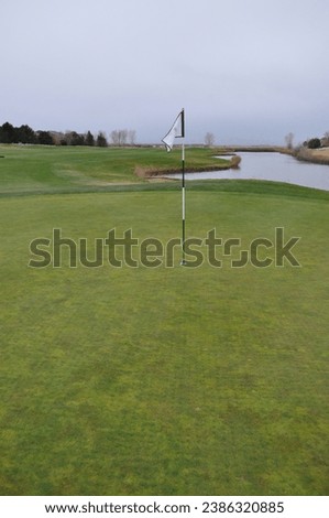 Golfcourse flag showing hole pin