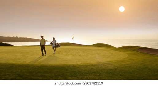 Golfer and caddy walking on golf course - Powered by Shutterstock