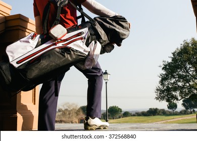 Golfer With His Bag Entering In A Golf Course