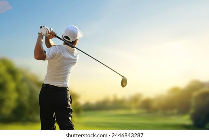 Golfer hit sweeping driver after hitting golf ball down the fairway with sunrise background. - Powered by Shutterstock