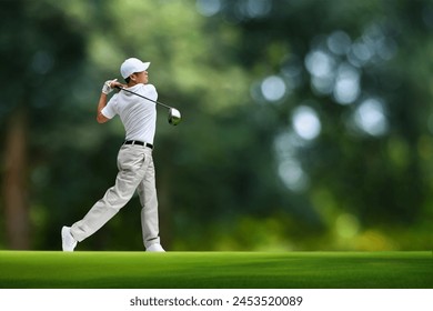 Golfer hit sweeping driver after hitting golf ball down the fairway. - Powered by Shutterstock
