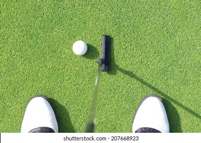 Golfer On Training Putt Golf Ball