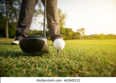 Golfer Prepare Drive Golf Ball From Tee Off. Copy Space On Right Side.