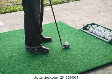 golfer preparing to swing at driving range