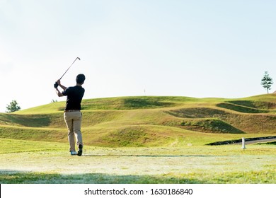 Golfer Sport Course Golf Ball Fairway.  People Lifestyle Man Playing Game Golf Tee Of On The Green Grass.  Asian Man Player Game Shot In Summer.  Healthy And Sport Outdoor