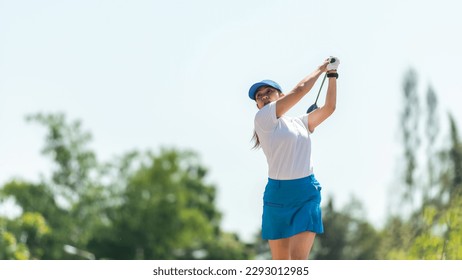 Golfer sport course golf ball fairway. People lifestyle woman playing game golf tee off on the green grass. Asia female player game shot in summer. Healthy and Sport outdoor - Powered by Shutterstock