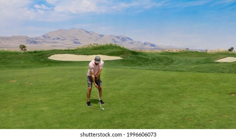 A Golfer Taking His Second Shot From The Fairway