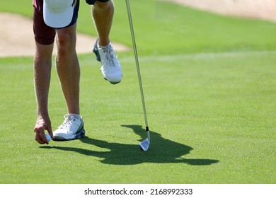 Golfers Hand Placing Golf Ball Onto Tee Close Up