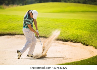 Golfers hit the ball in the sand. Speed and Strength