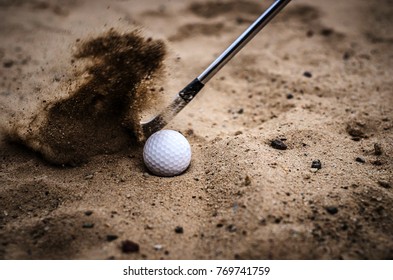 Golfers are hitting the golf ball by sand blasting - Powered by Shutterstock