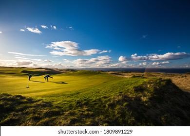 Golfers on a lovely golf course in St. Andrews, Scotland