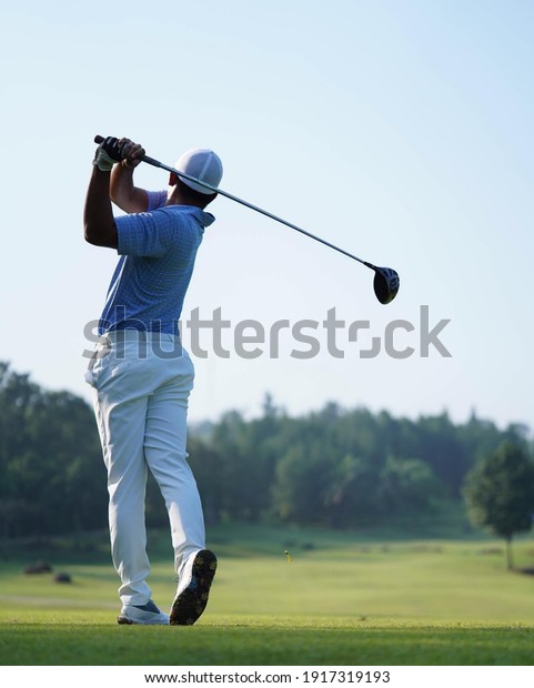 Golfers are\
playing golf at field court selective focus background . Fit for\
golf tournament sport tee cover banner\
