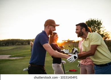 Golfing partners shaking hands after a game of golf - Powered by Shutterstock