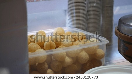 Golgappa or Pani Puri is a deep-fried breaded hollow spherical shell, about an inch (2.5 cm) in diameter, filled with a combination of finely diced potato, onion, peas and chickpea.