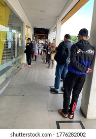 Gombak, Malaysia-15/07/2020: New normal practices after pendamic as people que to enter bank by taking their contact nombor via bar code