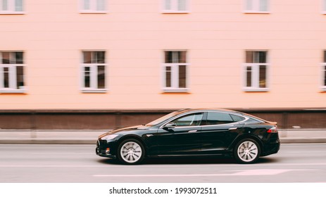 Gomel, Belarus - April 1, 2017: Black Color Tesla Model S Car In Motion On Street. The Tesla Model S Is A Full-sized All-electric Five-door, Luxury Liftback, Produced By Tesla Inc.