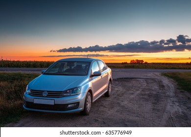 Gomel, Belarus - August 24, 2016: Volkswagen Polo Sedan Car Parking On A Roadside Of Country Road During Sunset Or Sunrise