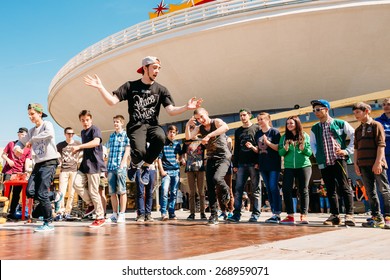 GOMEL, BELARUS - MAY 9, 2014: Battle Dance Youth Teams At The City Festival. Street Performer Break Dances For The Crowd