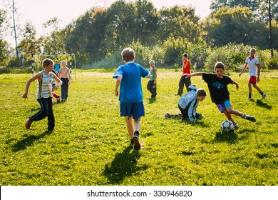 Gomel, Belarus - Sptember 9, 2010: Boys Play Football On Meadow