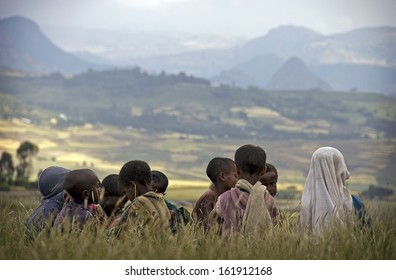 GONDAR, ETHIOPIA - NOVEMBER 11, 2012 - Pupils of a rural primary school having class in the grass.