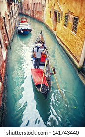 Gondola With Gondolier In Venice, Italy