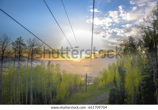 Gondola Lift over the sunset .\
Gondola travels between Telluride and Mountain Village\
Colorado.