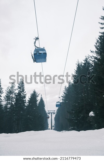 Gondola\
lift at ski resort in winter. Pirin\
Mountains