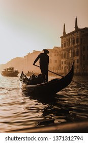 Gondola With Man On The Water