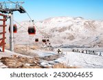 The Gondola Moving with Scenery of Group of Skiers at the Mount Erciyes