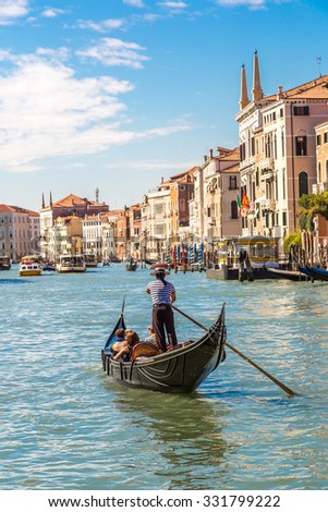 Gondola on Canal Grande in Venice, in a beautiful summer day in Italy