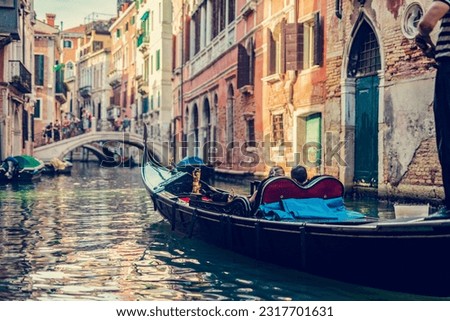 Gondola on canal in Venice, Italy. Romantic Venetian waterway