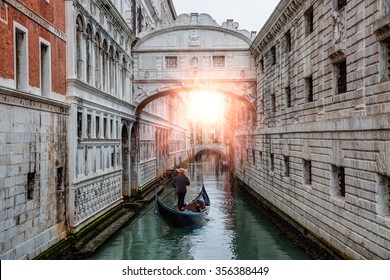 Gondolas floating on canal towards Bridge of Sighs (Ponte dei Sospiri). Venice, Italy