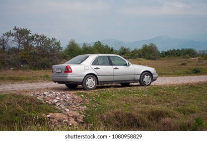 GONIO, GEORGIA- April 29, 2018: Old Mercedes Benz C Class W202 In The Fields Of Georgia