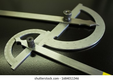 Goniometer vernier 0-180 ° on a black background - Shutterstock ID 1684011346