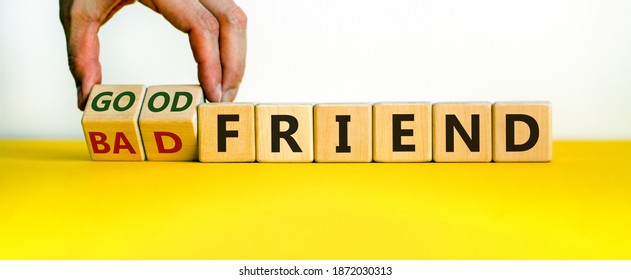 Good Or Bad Friend Symbol. Male Hand Turns Wooden Cubes And Changes Words 'Bad Friend' To 'Good Friend'. Beautiful White Background. Business And Friendship Concept, Copy Space.