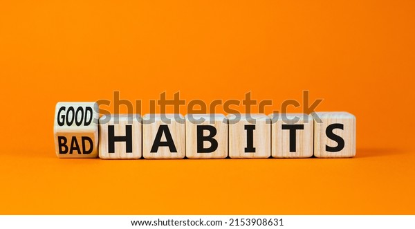 Good or\
bad habits symbol. Turned wooden cubes and changed concept words\
Old habits to New habits. Beautiful orange table orange background.\
Business old or new habits concept. Copy\
space.