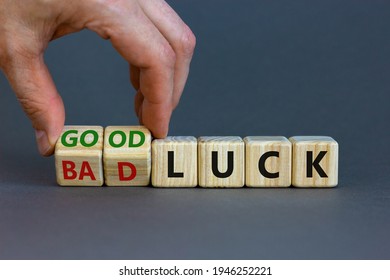 Good Or Bad Luck Symbol. Businessman Turns Wooden Cubes And Changes Words 'bad Luck' To 'good Luck'. Beautiful Grey Background, Copy Space. Business And Good Or Bad Luck Concept.