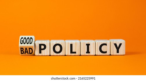 Good or bad policy symbol. Turned wooden cubes and changed concept words Bad policy to Good policy. Beautiful orange table orange background. Business bad or good policy concept. Copy space.