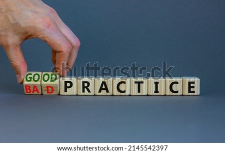 Good or bad practice symbol. Businessman turns wooden cubes and changes words 'bad practice' to 'good practice'. Beautiful grey background. Business, good or bad practice concept. Copy space.