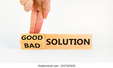 Good or bad solution concept. Businessman turns a block and changes words 'bad solution' to 'good solution'. Beautiful white background. Business, good or bad solution concept. Copy space.
