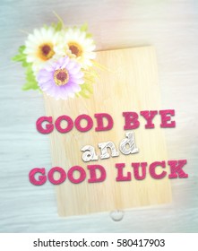 GOOD BYE AND GOOD LUCK Words On The Wooden Background Vintage Retro Or Rustic Style With Flowers