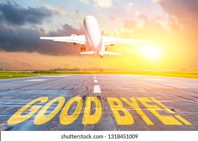 Good Bye Luck Written On Runway Airport, And The Airplane Take Off Into The Sunset. Concept Of Departure Return Home.