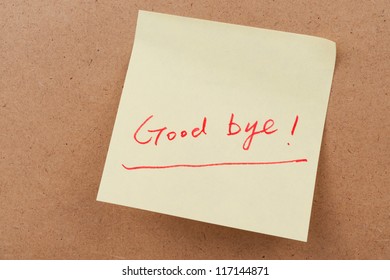 Good Bye Words Written On Sticky Note And Attached On The Board