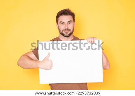 Good choice, recommend like concept with copy space. Man with blank sign board for advertising.