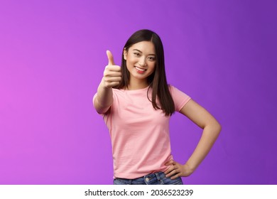 Good Choice, Well Done. Pleased Happy Asian Woman In Pink T-shirt Show Thumb-up, Approving Like Your Idea, Smiling Joyfully, Accept Plan, Agree, Recommend Product, Give Positive Judgement